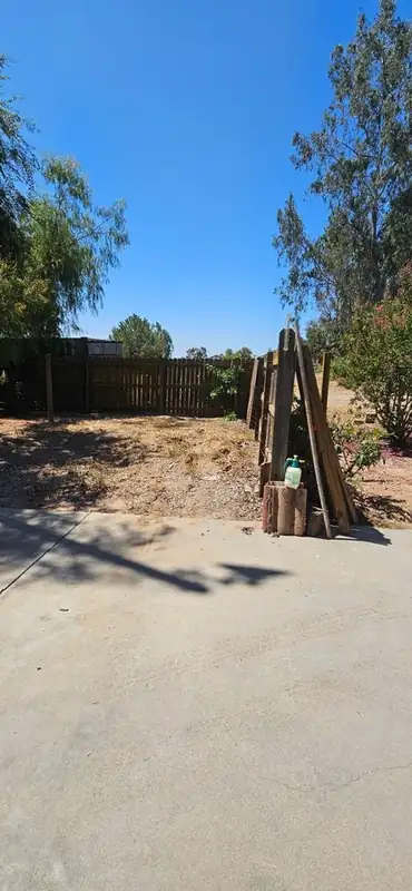 Backyard cleared with old posts removed and debris hauled
